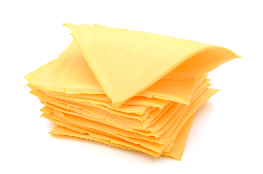 A,Pile,Of,Cheese,Slices,Isolated,On,White