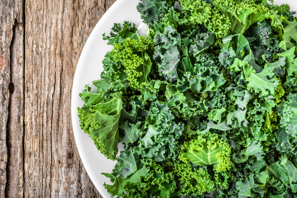 Kale.,Green,Vegetable,Leaves,,Top,View,On,White,Plate,,Healthy
