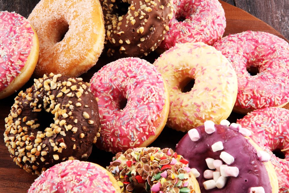 Assorted,Donuts,With,Chocolate,Frosted,,Pink,Glazed,And,Sprinkles,Donuts.