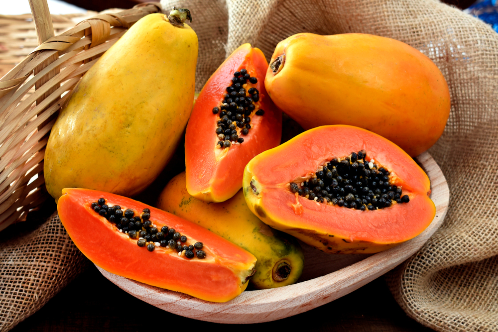 The,Papaya,Fruits,In,A,Wooden,Pot,And,A,Straw