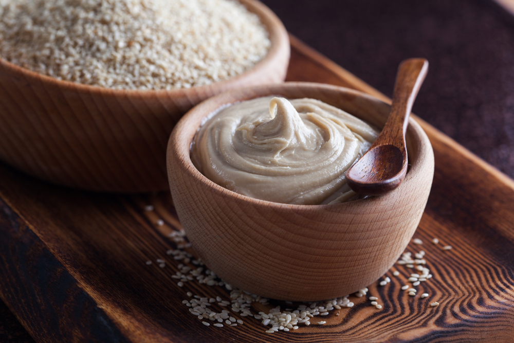 Wooden,Bowl,Of,Tahini,Sauce,-,Food,And,Drink