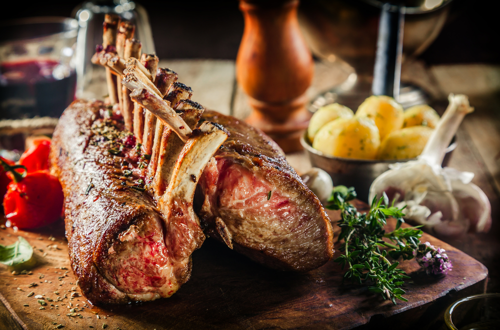 Roasted,Rectangle,Rack,Of,Lamb,Chops,On,Wooden,Cutting,Board