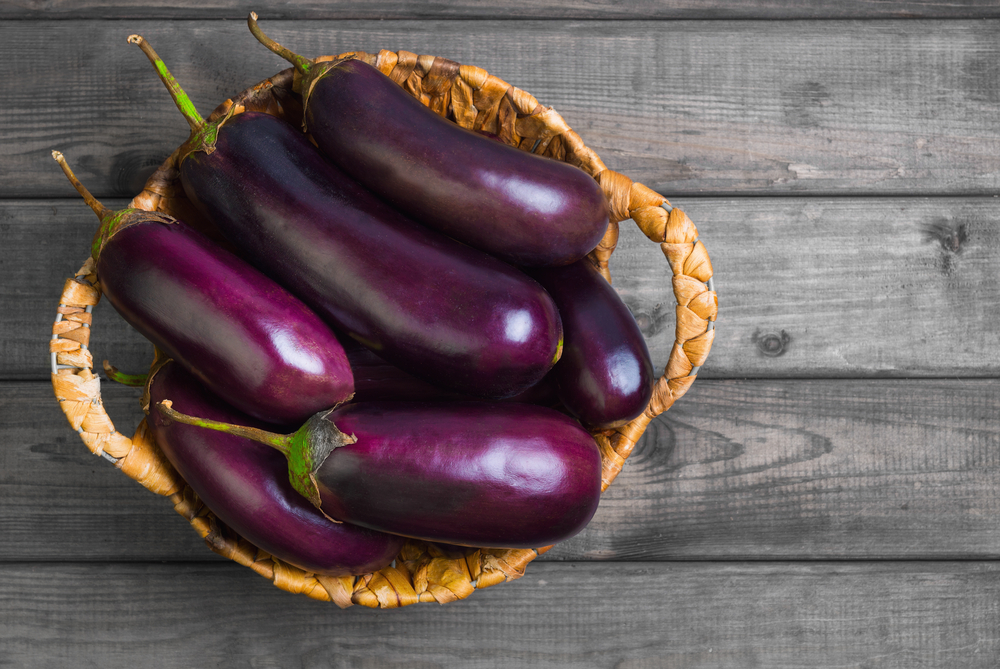 Fresh,Raw,Purple,Eggplant,In,A,Special,Wicker,Basket,For