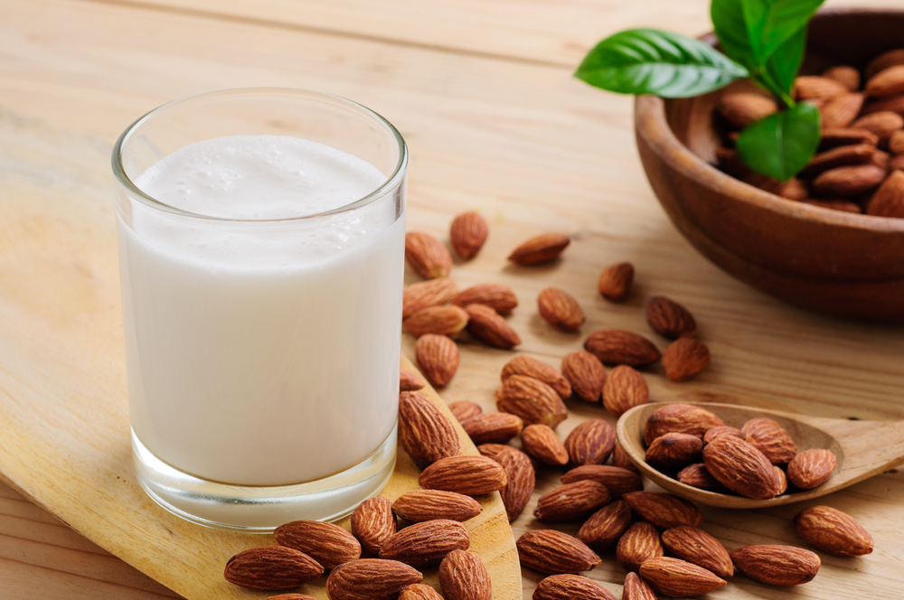Almond,Milk,With,Almond,On,A,Wooden,Table