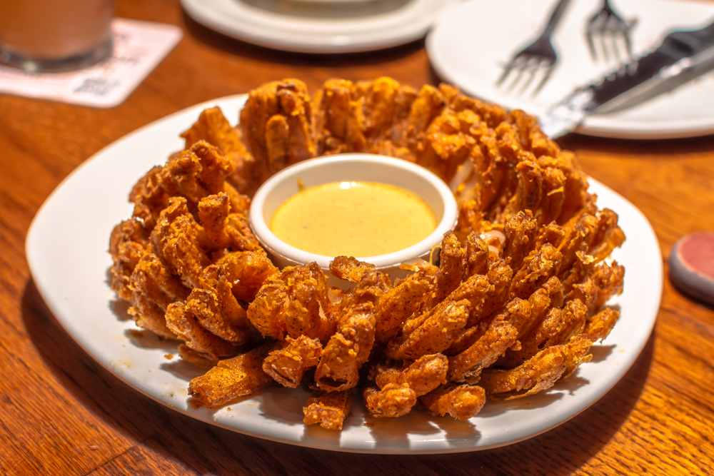 Fried,Blooming,Onion,With,Dipping,Sauce.