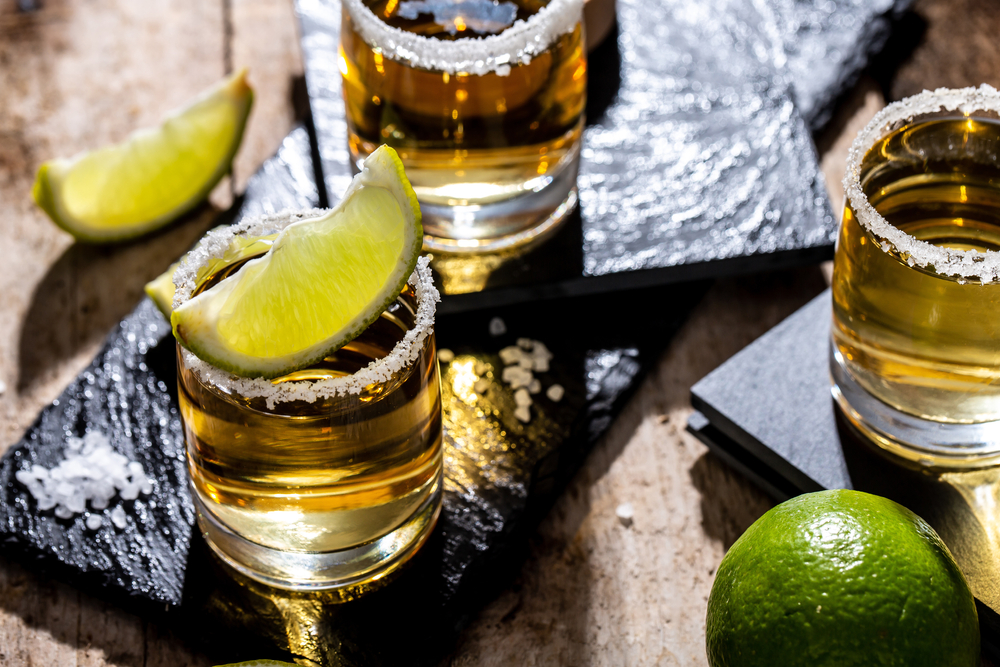 Mexican,Tequila,With,Lime,And,Salt,On,Black,Background.,Space