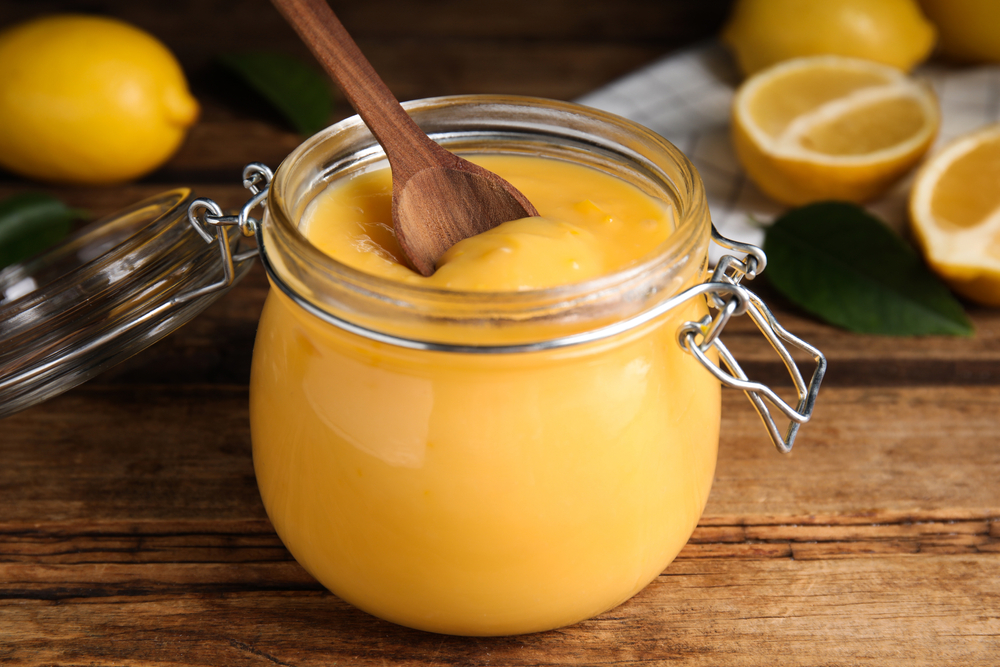 Delicious,Lemon,Curd,In,Glass,Jar,On,Wooden,Table