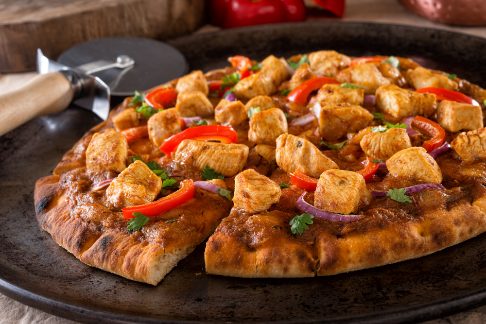 A,Delicious,Butter,Chicken,Pizza,With,Red,Pepper,,Red,Onion