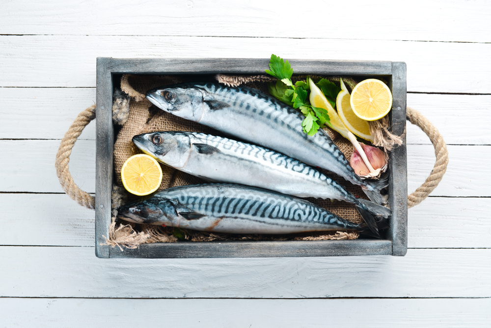 Mackerel,On,A,White,Wooden,Background.,Raw,Fish,Top,View.
