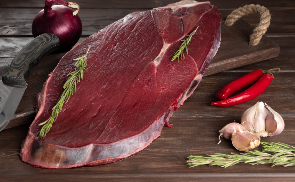 Piece,Of,Fresh,Raw,Meat,On,A,Wooden,Background.,Meat,