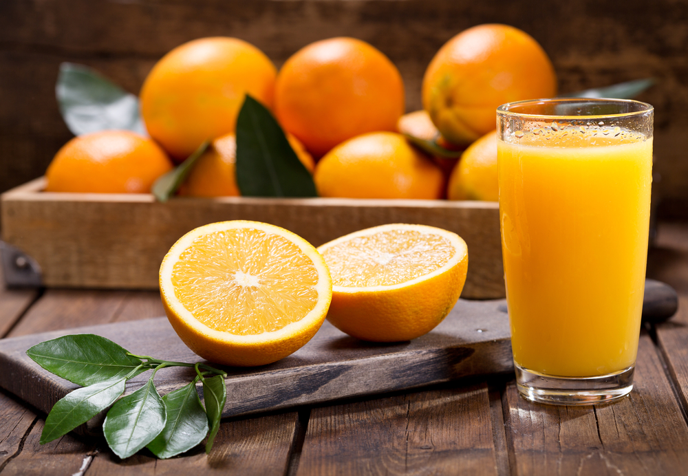 Glass,Of,Fresh,Orange,Juice,With,Fresh,Fruits,On,Wooden