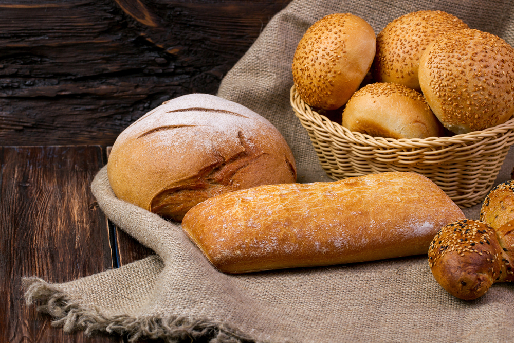 Assortment of baked bread on wooden