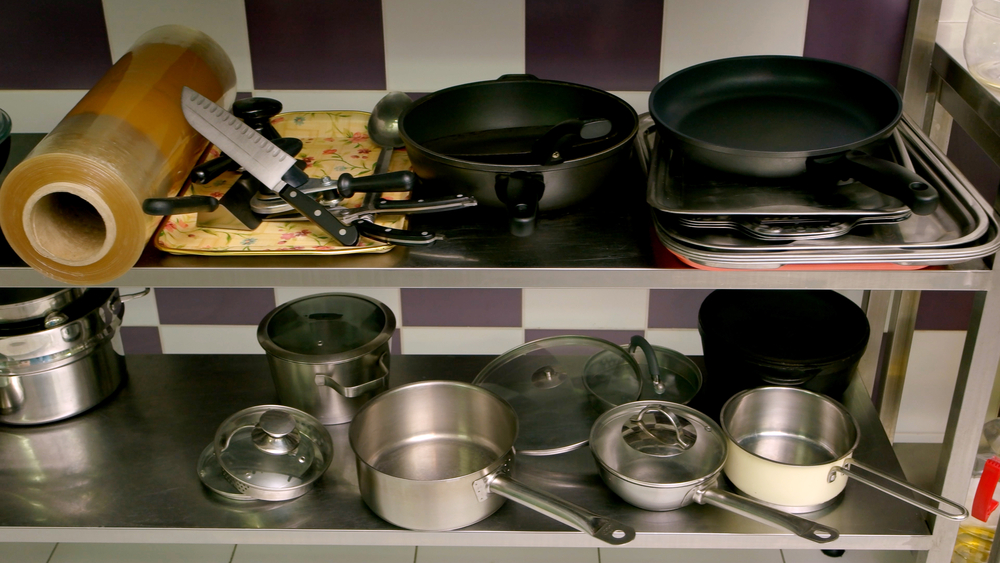 Various utensils on kitchen counter.