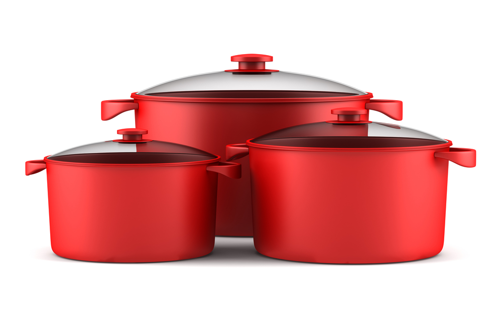 three red cooking pans isolated on white background