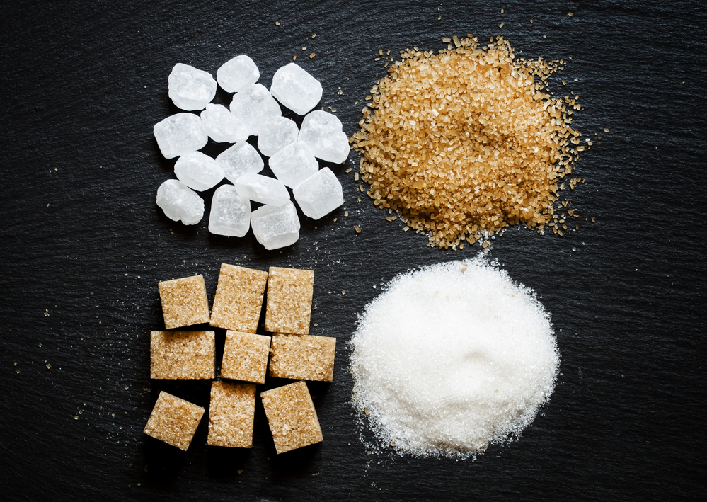 Assortment of sugar: white sand, candy sugar, brown sugar into p