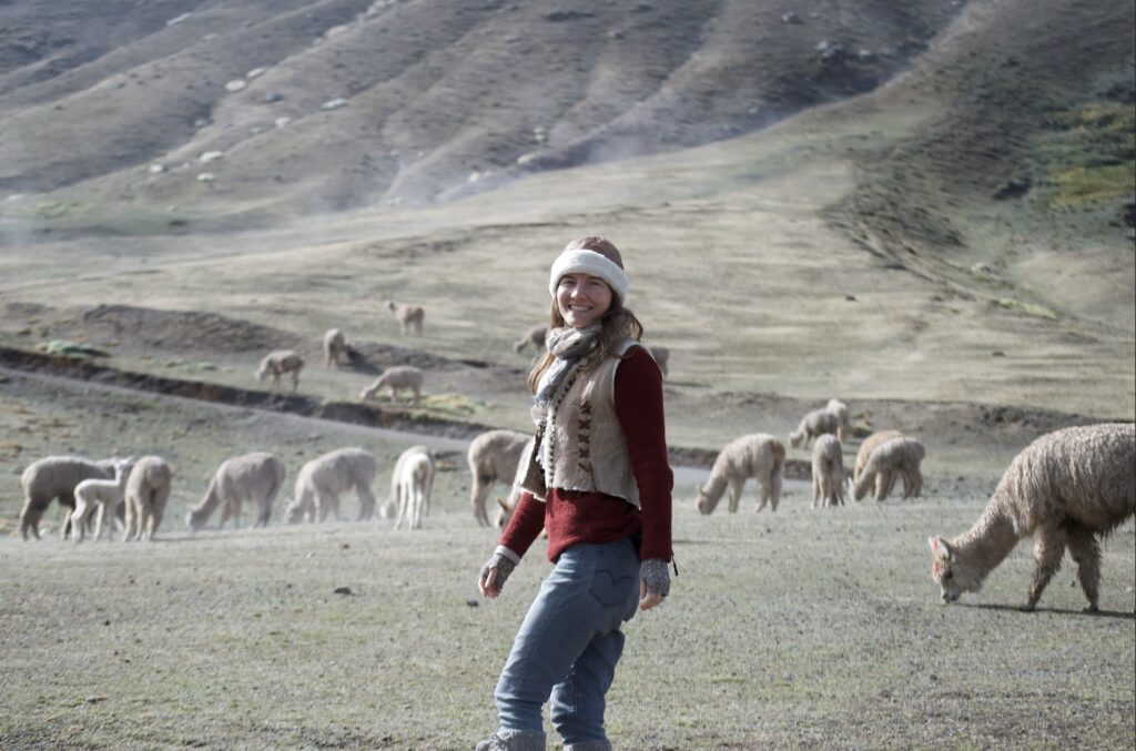 Ava Shije with alpacas in the highlands of Peru