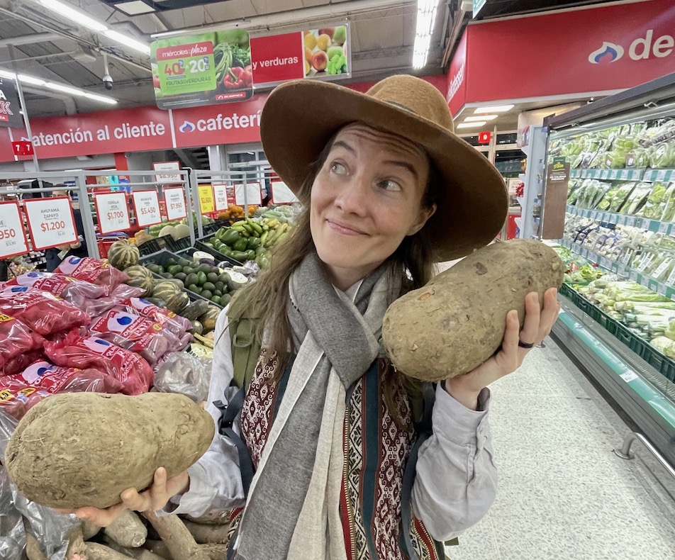 Ava Shije buying large potatoes in a supermarket in South America