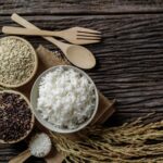 spices, spoon and fork on wooden table